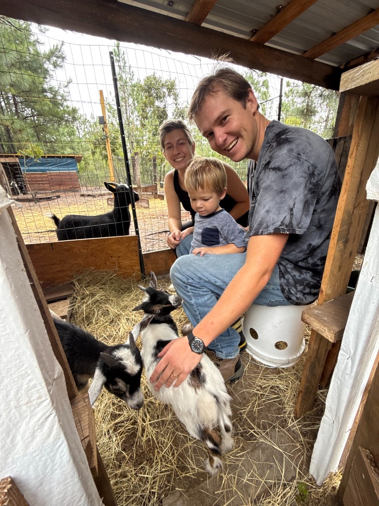 Farm family with goats